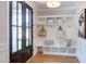 Bright entryway with built-in bench, cubbies, and hooks at 85 Harvest View Way, Franklinton, NC 27525