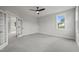 Spacious bedroom with French doors and grey carpet at 85 Harvest View Way, Franklinton, NC 27525