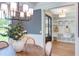 Formal dining room with a round table, chandelier, and gray walls at 85 Harvest View Way, Franklinton, NC 27525