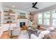 Cozy living room features a fireplace and built-in shelving at 85 Harvest View Way, Franklinton, NC 27525