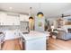Modern kitchen with white cabinets, quartz countertops, and island at 85 Harvest View Way, Franklinton, NC 27525