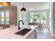 Eat-in kitchen with white cabinets and quartz countertops at 85 Harvest View Way, Franklinton, NC 27525