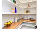 Well-organized pantry with wooden shelves and ample storage at 85 Harvest View Way, Franklinton, NC 27525