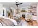 Bright living room with fireplace and built-in shelves at 85 Harvest View Way, Franklinton, NC 27525