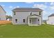 Two story house with gray siding and covered patio at 540 Husketh Rd, Youngsville, NC 27596