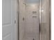 Modern shower with glass enclosure and tiled walls at 530 Husketh Rd, Youngsville, NC 27596