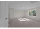 Spacious bedroom with carpet and large window at 530 Husketh Rd, Youngsville, NC 27596