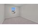Simple bedroom with carpeted floor and window at 530 Husketh Rd, Youngsville, NC 27596
