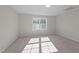 Bright bedroom featuring carpeted floor and window at 530 Husketh Rd, Youngsville, NC 27596