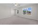 Spacious bedroom with carpet flooring and large windows offering natural light at 530 Husketh Rd, Youngsville, NC 27596