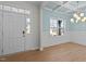 Bright dining room with light blue walls, crown molding, and hardwood floors at 530 Husketh Rd, Youngsville, NC 27596