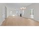 Bright living room featuring hardwood floors, fireplace, and access to backyard at 530 Husketh Rd, Youngsville, NC 27596