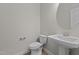 Clean powder room with pedestal sink and toilet at 530 Husketh Rd, Youngsville, NC 27596