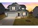 Two-story home with gray siding, white trim, and a landscaped yard at 545 Husketh Rd, Youngsville, NC 27596