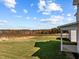 Spacious backyard with grassy lawn and wooded backdrop at 545 Husketh Rd, Youngsville, NC 27596