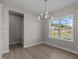 Bright dining area with a chandelier and large window at 545 Husketh Rd, Youngsville, NC 27596