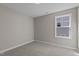 Simple bedroom with carpeted floor and window at 545 Husketh Rd, Youngsville, NC 27596