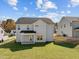 Two-story house with gray siding, covered patio, and grassy lawn at 545 Husketh Rd, Youngsville, NC 27596