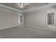 Spacious carpeted bedroom with an ensuite bathroom and walk-in closet at 545 Husketh Rd, Youngsville, NC 27596