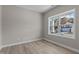 Spacious bedroom with large windows and light gray walls at 545 Husketh Rd, Youngsville, NC 27596