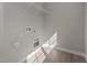 Laundry room with built-in shelving and vinyl flooring at 545 Husketh Rd, Youngsville, NC 27596
