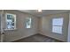 Bright bedroom with carpet flooring and multiple windows at 1341 Underbrush Dr, Durham, NC 27703