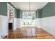 Elegant dining room with hardwood floors and large windows at 4905 Hidden Pasture Way, Zebulon, NC 27597