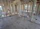 Spacious unfinished room with wood framing and flooring at 4905 Hidden Pasture Way, Zebulon, NC 27597