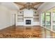 Living room with a fireplace and built-in shelving at 4905 Hidden Pasture Way, Zebulon, NC 27597