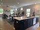 Open concept kitchen with island and stainless steel appliances at 117 Vega Loop # 68, Sanford, NC 27330