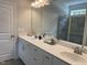Double vanity bathroom with a large mirror and walk-in shower at 117 Vega Loop # 68, Sanford, NC 27330