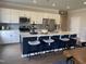Modern kitchen with a large island and navy blue cabinets at 117 Vega Loop # 68, Sanford, NC 27330