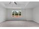 Bright bedroom featuring a ceiling fan and large window at 816 Pryor St # 54, Mebane, NC 27302
