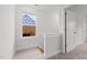 Upstairs hallway with staircase and doors to bedrooms at 816 Pryor St # 54, Mebane, NC 27302