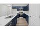 Modern kitchen with dark blue cabinets and quartz countertops at 816 Pryor St # 54, Mebane, NC 27302