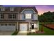 Two-story townhome with two-car garage and landscaped yard at 816 Pryor St # 54, Mebane, NC 27302