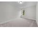 Simple bedroom with window and carpeted floor at 816 Pryor St # 54, Mebane, NC 27302