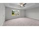 Spacious bedroom with carpeted floor and large window at 816 Pryor St # 54, Mebane, NC 27302
