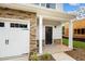 Modern front entrance with stone accents and a two-car garage at 816 Pryor St # 54, Mebane, NC 27302