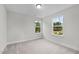 Well-lit bedroom with two windows and carpeted floor at 816 Pryor St # 54, Mebane, NC 27302