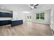 Open concept living area with hardwood floors and kitchen island at 816 Pryor St # 54, Mebane, NC 27302