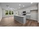 Modern kitchen with gray cabinets, quartz countertops, and stainless steel appliances at 818 Pryor St # 55, Mebane, NC 27302