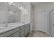 Double vanity bathroom with gray cabinets and a large mirror at 818 Pryor St # 55, Mebane, NC 27302