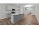 Modern kitchen with gray cabinets, quartz countertops, and stainless steel appliances at 818 Pryor St # 55, Mebane, NC 27302
