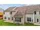 Rear view of townhome with sunroom and lawn at 818 Pryor St # 55, Mebane, NC 27302
