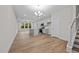 Open concept dining area with hardwood floors and a chandelier at 818 Pryor St # 55, Mebane, NC 27302