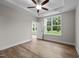 Spacious bedroom featuring wood-look floors and a ceiling fan at 818 Pryor St # 55, Mebane, NC 27302