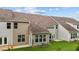 Rear view of townhome with sunroom and lawn at 818 Pryor St # 55, Mebane, NC 27302