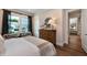 Bedroom with hardwood floors, natural light, and access to another room at 4213 Burlington Mills Rd, Wake Forest, NC 27587