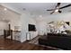 Bonus room with hardwood floors, sectional sofa, and a view of the upper hallway at 4213 Burlington Mills Rd, Wake Forest, NC 27587